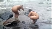 2992477 two indian mature womens bathing in river naked