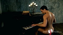 Hot young man with erect dick and nice butt strips naked playing the piano