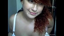 Busty redhead shows off her feet on webcam
