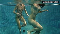 Two sexy amateurs showing their bodies off under water