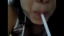 My naughty girl drinking milk through a straw