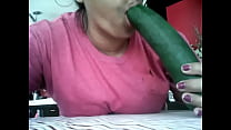 Lady sucking cucumber