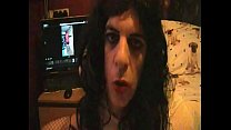 bisexual crossdressing sissy faggot plays with his cock and shoots a cumshot after watching himself on the computer next to him