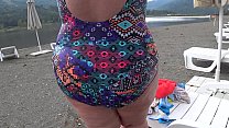 BBW with big booty in tight jeans is dressing in a public dressing room on the beach. Fetish.