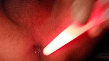 Playing with penlight in anal