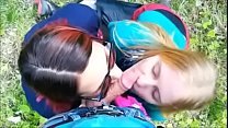 Two hot babes sucking cock in public.