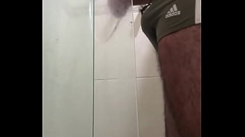 Hard cock in adidas swim trunks