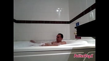 PETTER DOGX TAKING A BATH ALONE IN THE BATHTUB OF HIS MUIOT SEXY HOME.
