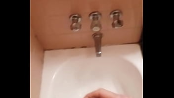 Pissing hard at the bathtub