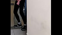 Young guy in lycra leggings jerks off in a corridor