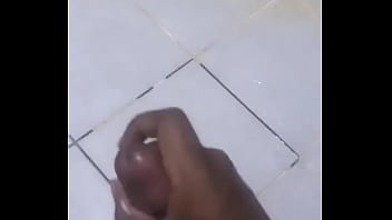 While at work I felt like milking my dick   so I went in the bathroom  took off my clothes and I started Jerking off in Kampala uganda  watch and enjoy