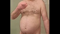 Nude Martin Lavallée masturbates, ejaculates and swallows his sperm
