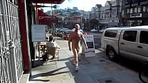 Nude in the street with public on daylight