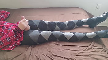 Crossdresser jerking off in plaid dress and argyle tights
