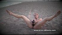 Naked and dirty with my huge black sextoy on the beach